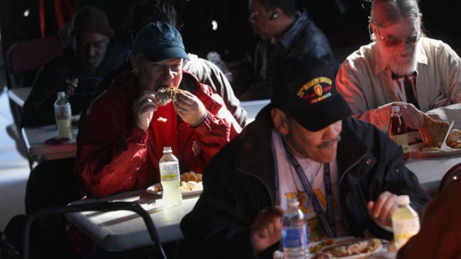 Homeless US military veterans eat a free lunch at a Stand Down event hosted by the Department of Veterans Affairs