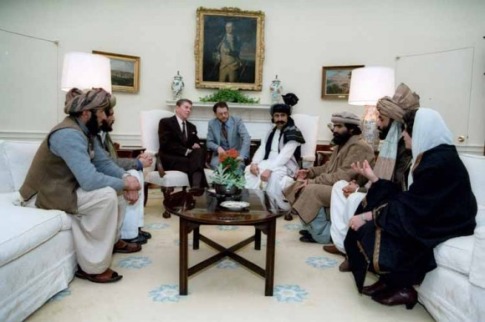 President Ronald Reagan sitting in the White House with Afghan freedom fighters in February 1983