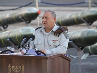 IDF chief Gadi Eizenkot with some of munitions he intends to hurl against 1.5-million Lebanese civilians