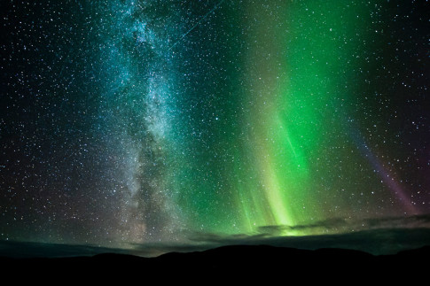 northern lights, the Milky Way and several shooting stars are seen in the night sky at Ifjord in Finnmark, Norway