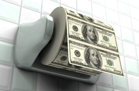 Roll of $100 bills on a toilet paper spindle
