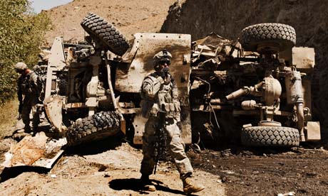 a-us-soldier-inspects-the-site-of-a-bomb-attack-in-afghanistan
