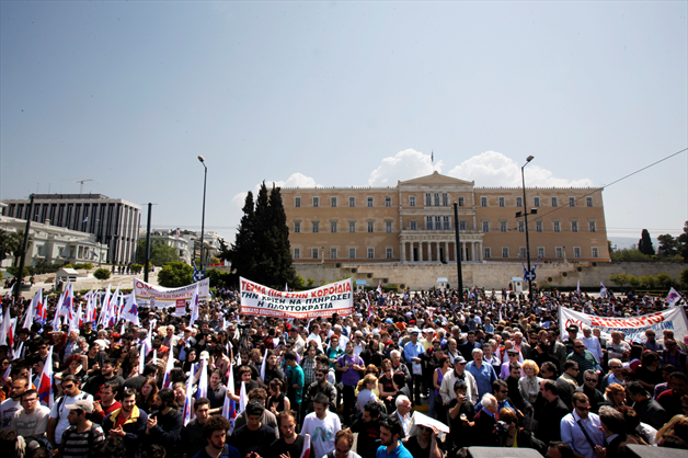 protestors-stand-in-front-of-the-greek-parliament-in-athens