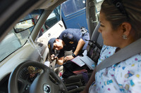 a-us-customs-and-border-protection-agent-inspects-a-vehicle