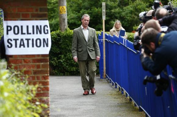 Nigel Farage, the leader of Britain's UKIP party arrives to vote in local and European elections at a polling station in Biggin Hill on the outskirts of London