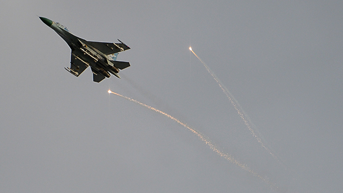 A Ukrainian fighter flies above Lugansk during a battle between resistance fighters and the Ukrainian National Guard in June 2, 2014
