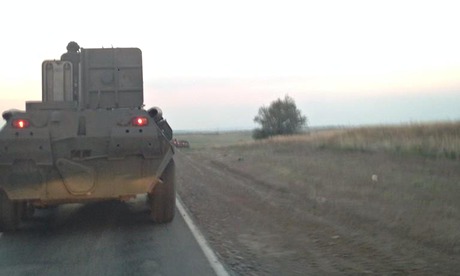 Armoured personnel carriers with Russian military plates move towards the Ukraine border