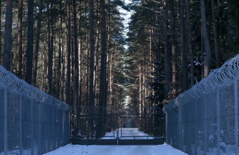 File photo of barbed wire fence surrounding military area near Stare Kiejkuty village, in Northeastern Poland