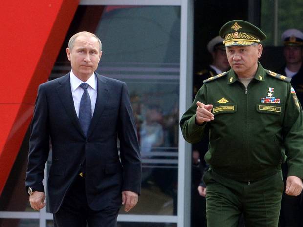 Vladimir Putin and Defence Minister Sergei Shoigu