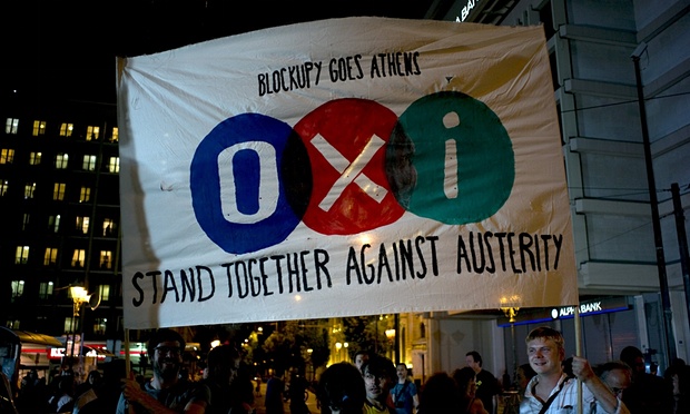 No vote supporters hold a banner during celebrations in Athens